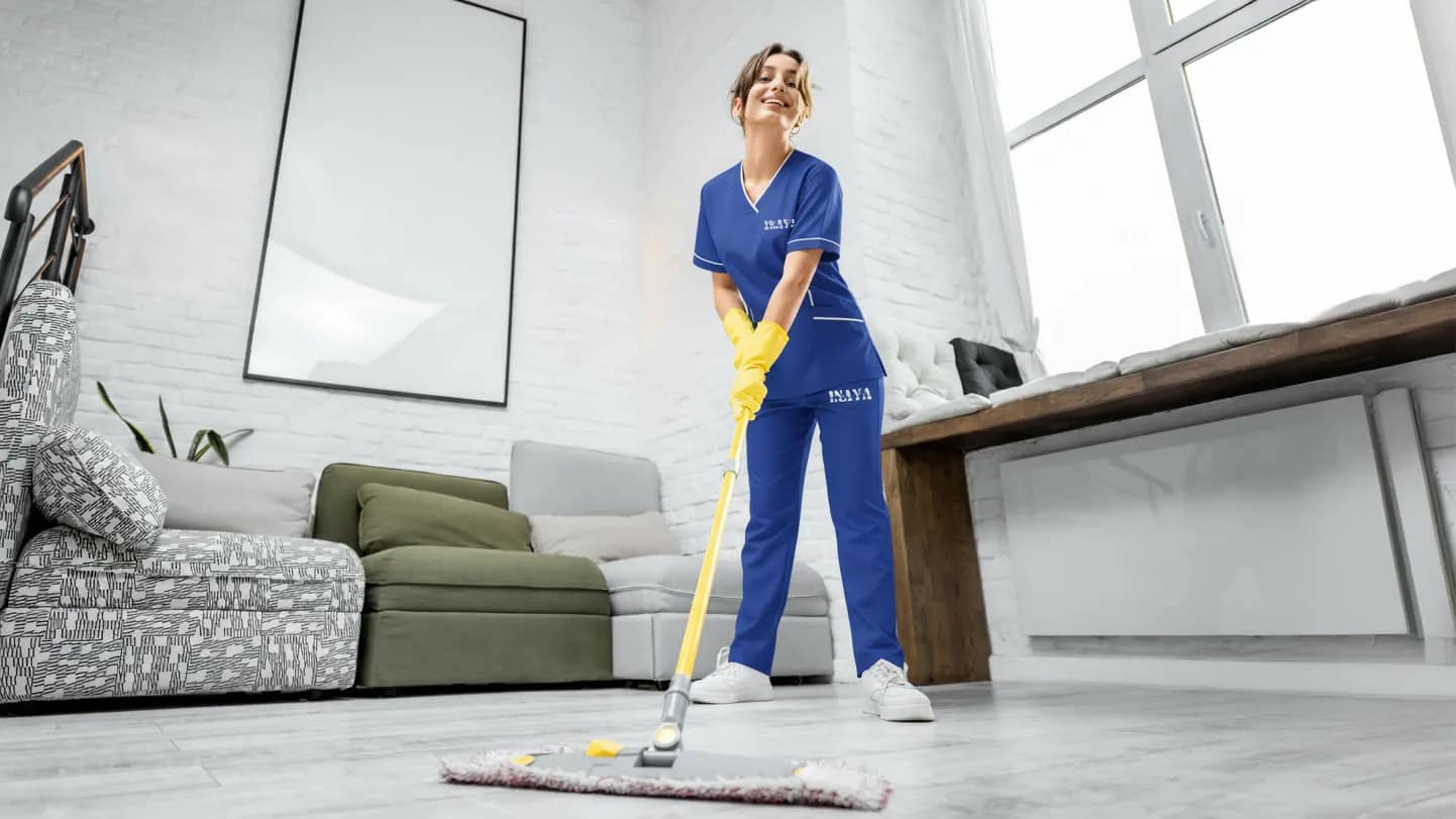 Maid operating washing machine at home