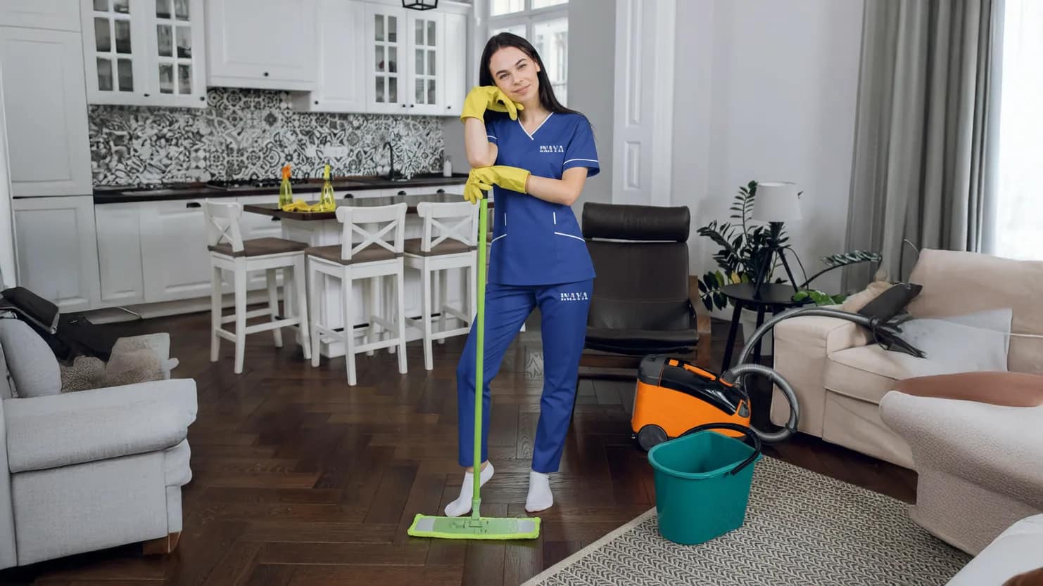 Maid cleaning tiles and sink