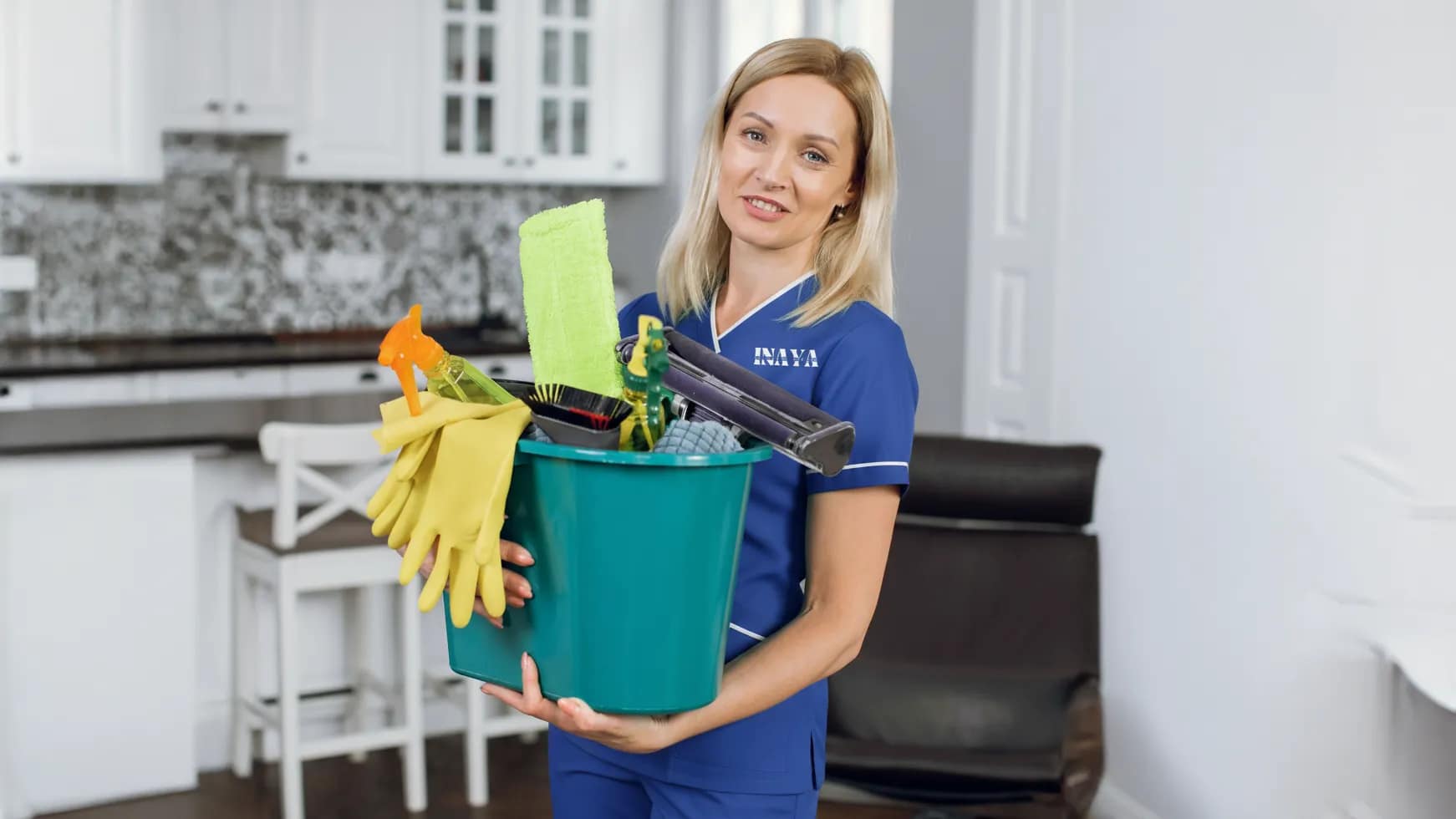 Uniformed INAYA maid ironing clothes carefully